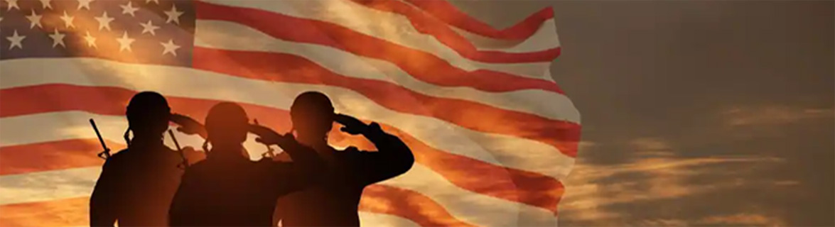 Soldiers saluting American flag